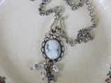 Blue and White Cameo necklace with front large clasp all in silver metals.